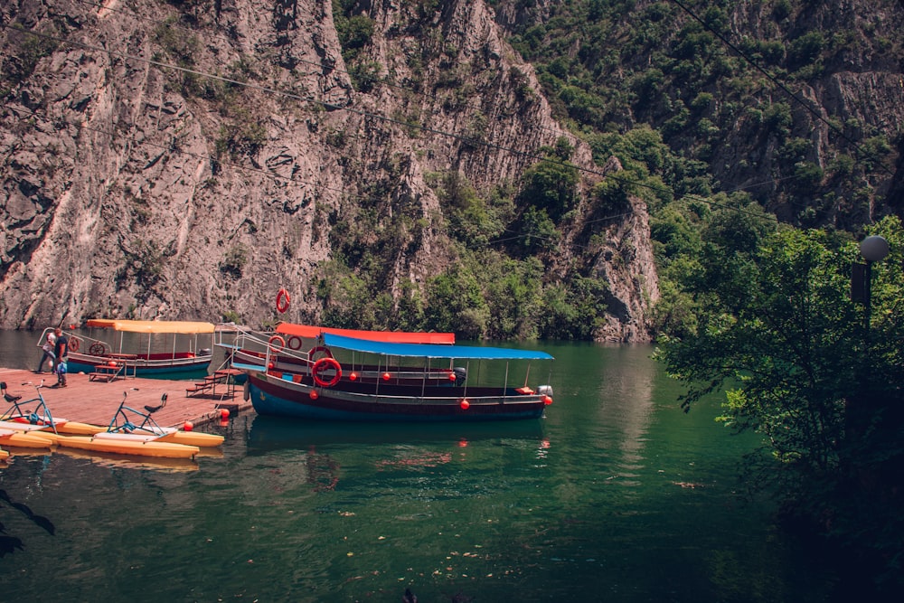 a couple of boats floating on top of a river