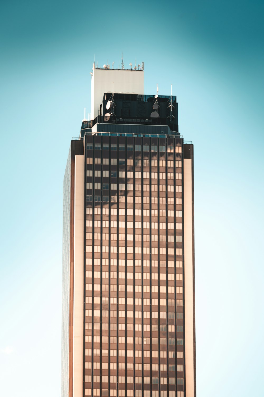 a tall building with a sky background