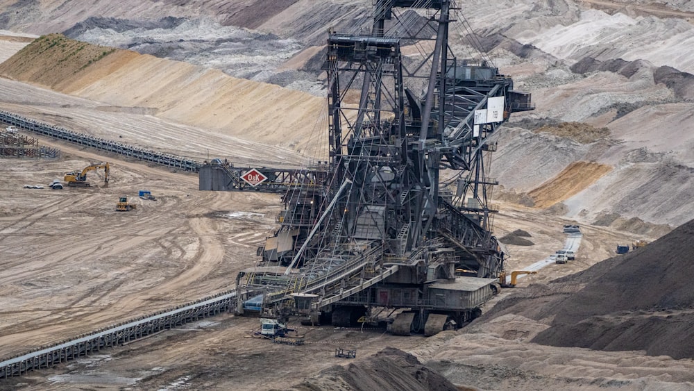 a large machine is in the middle of a quarry