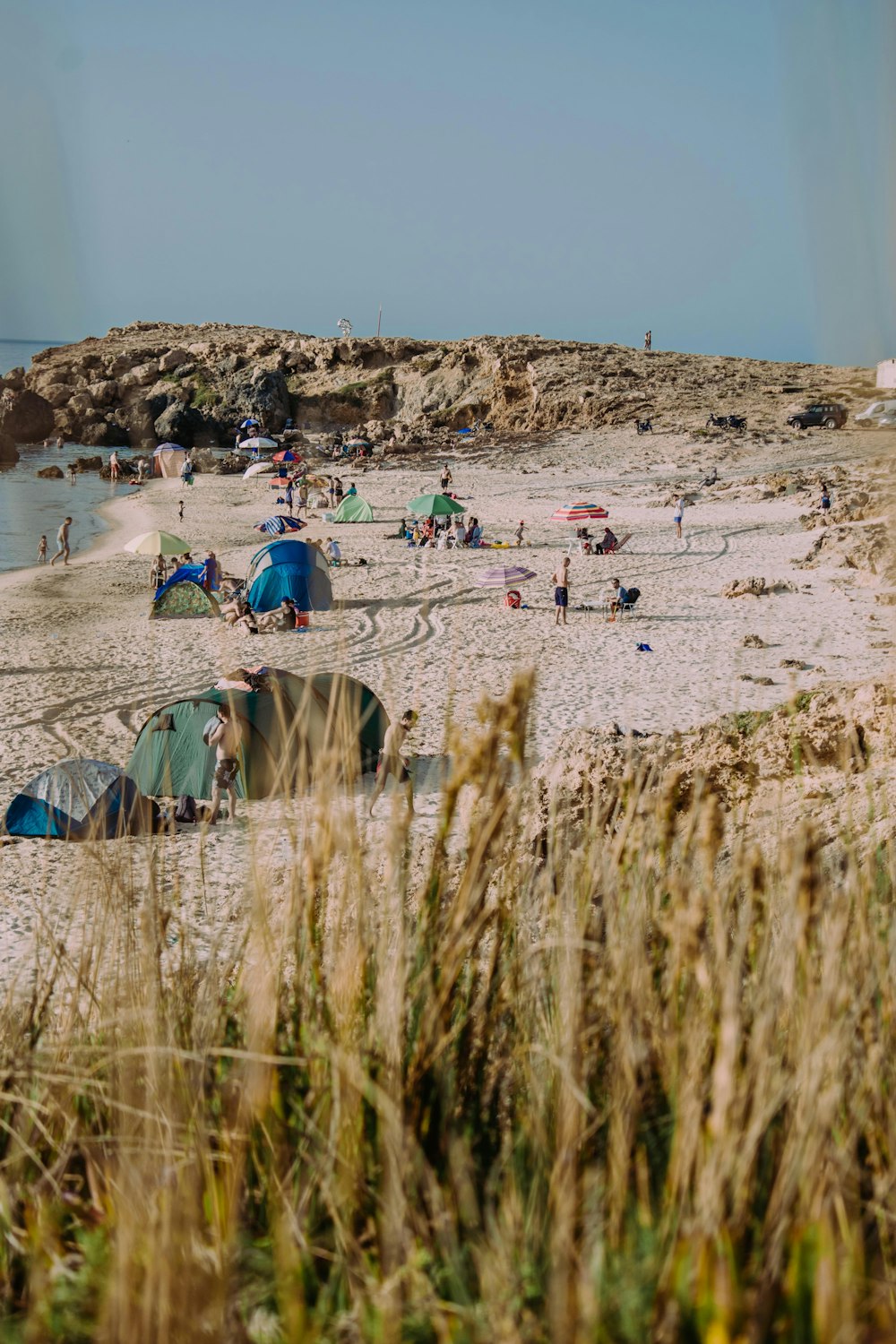 a group of tents set up on a beach