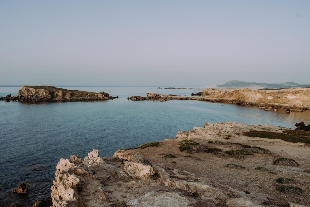 a large body of water surrounded by rocks