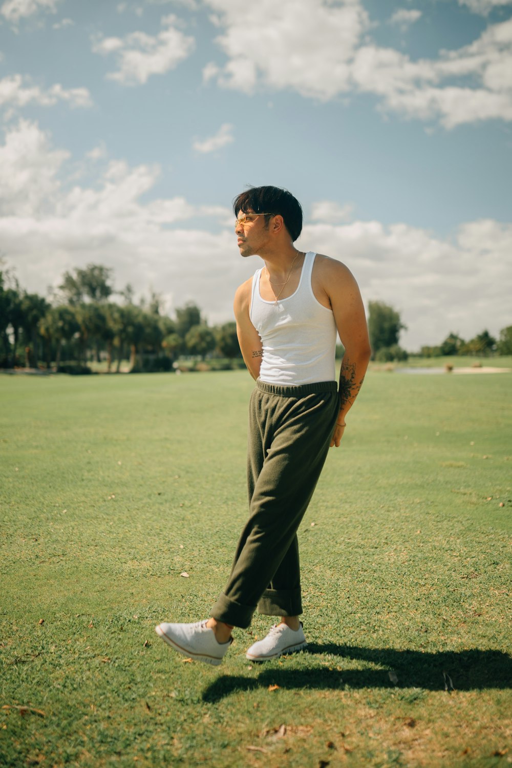 a man standing in the middle of a field