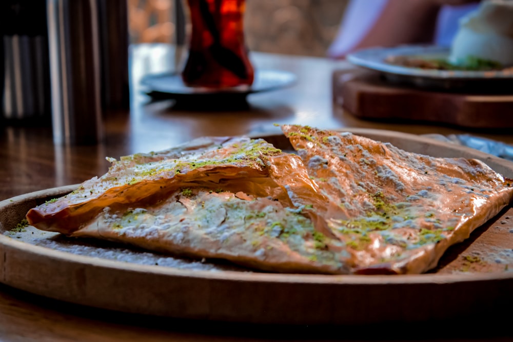 a plate of food on a wooden table