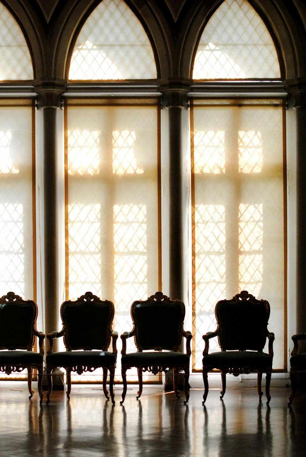 a row of chairs sitting in front of a window