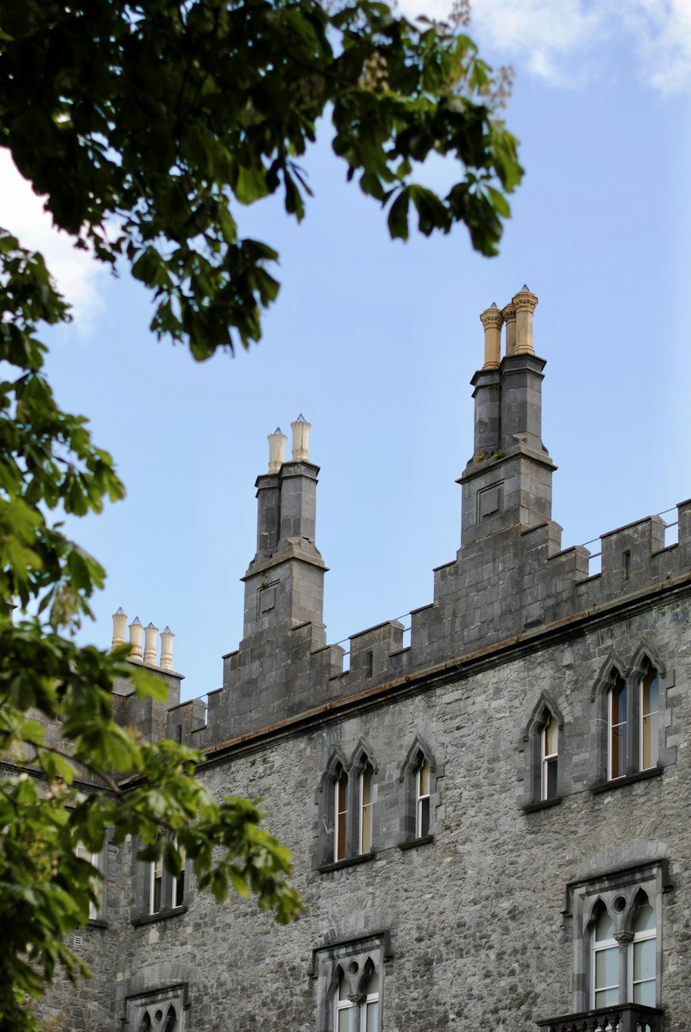 a large stone building with two towers on top of it