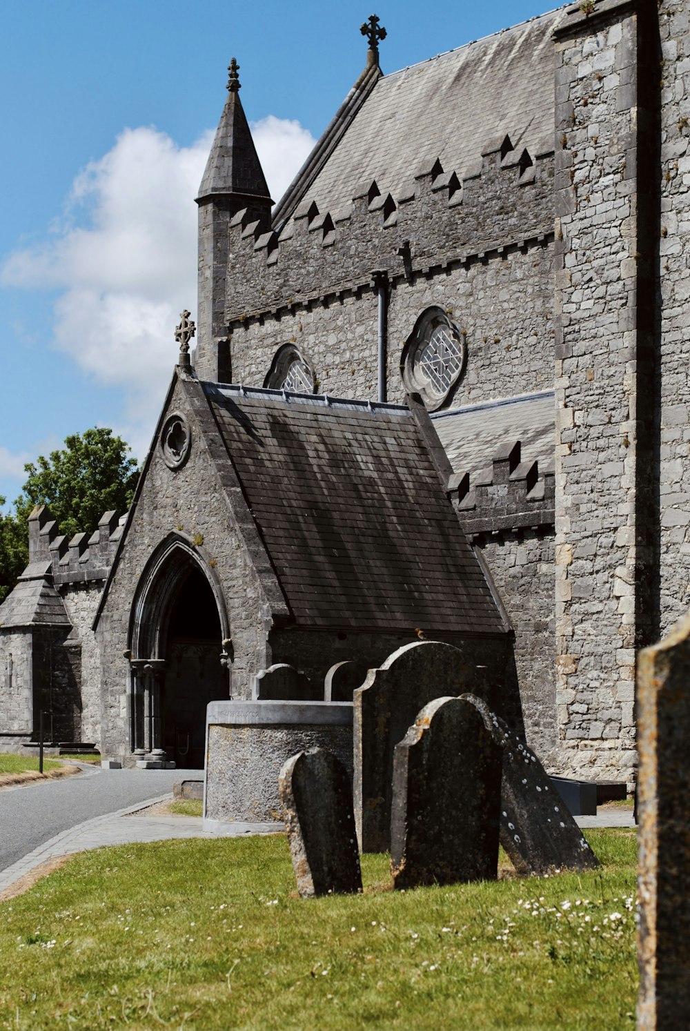 an old stone church with a steeple and a clock