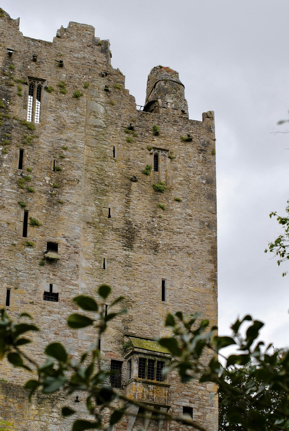 a tall tower with a clock on the side of it