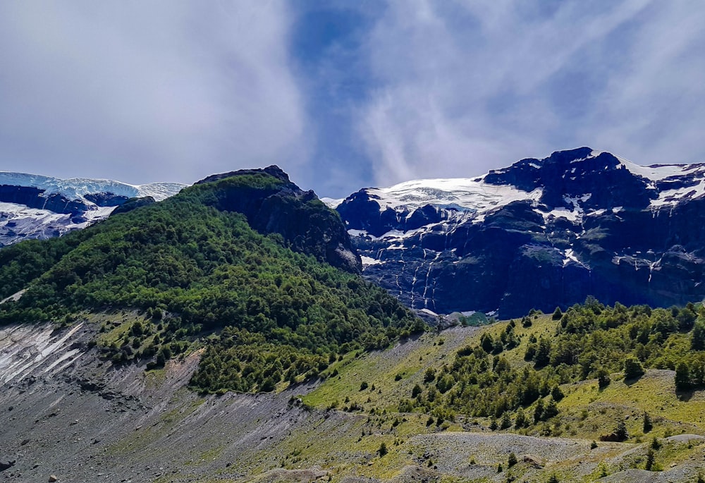 a view of a mountain range with snow on the top