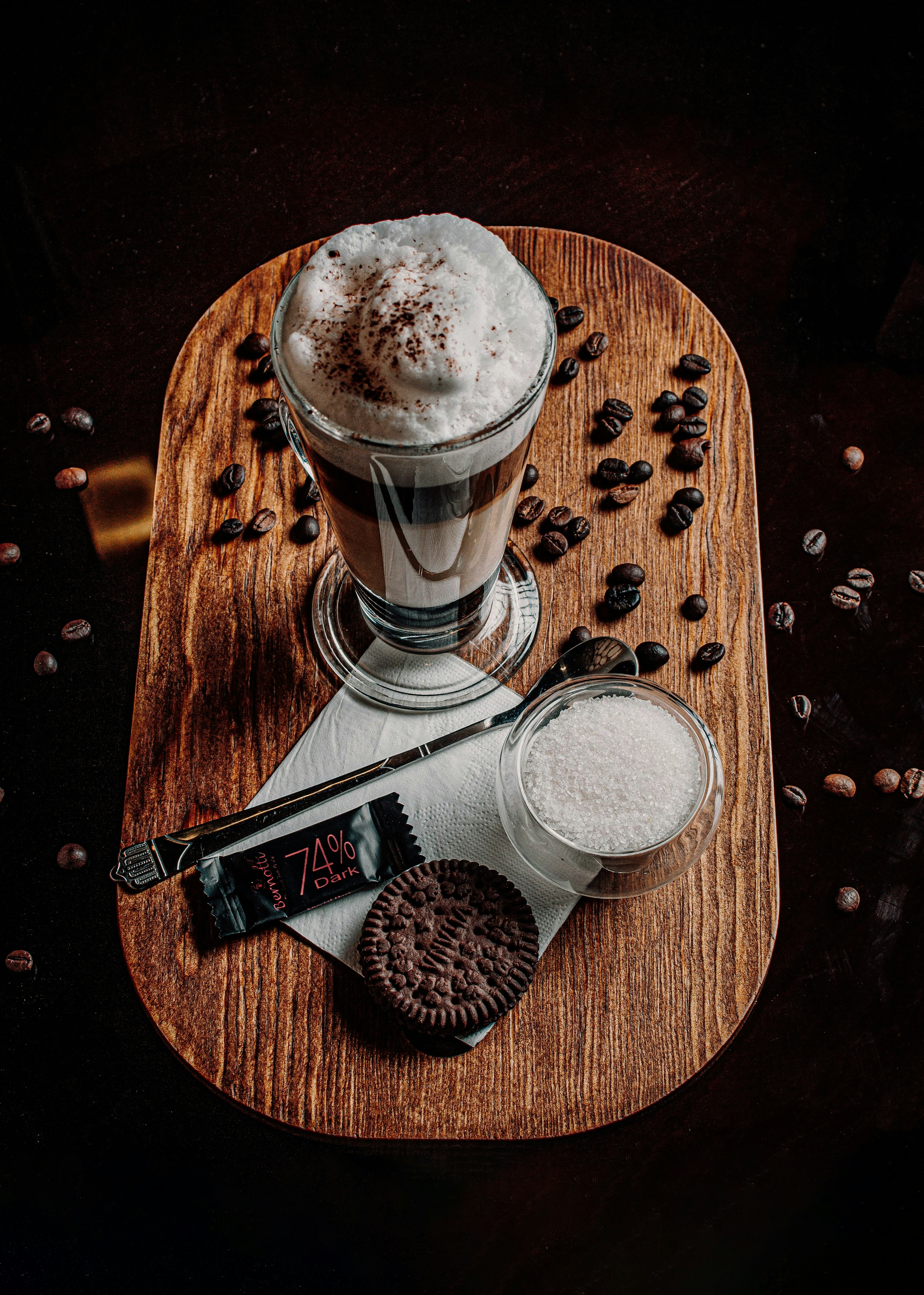 a wooden tray topped with a cup of coffee