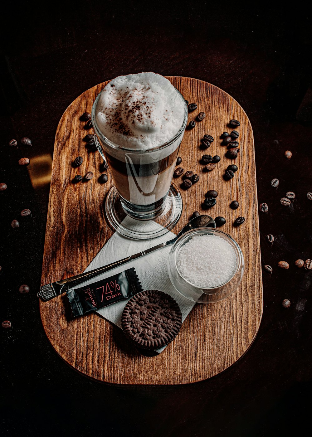 a wooden tray topped with a cup of coffee