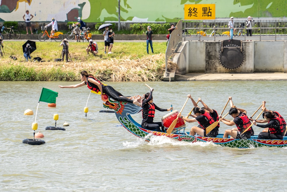 a group of people riding on the back of a boat