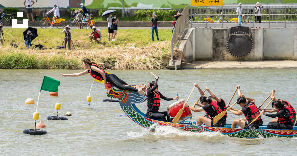 A group of people riding on the back of a boat photo – Free Festival ...
