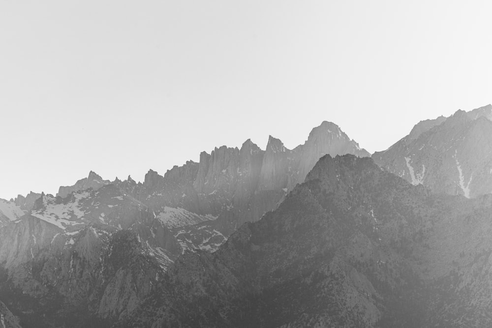 a black and white photo of a mountain range