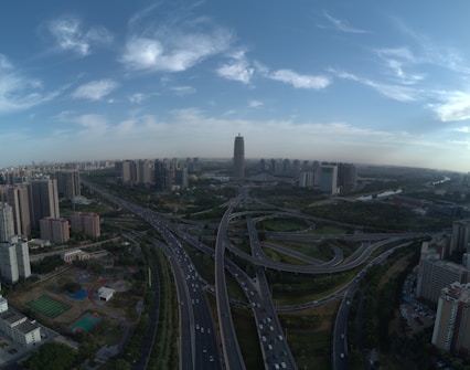 an aerial view of a highway intersection in a city