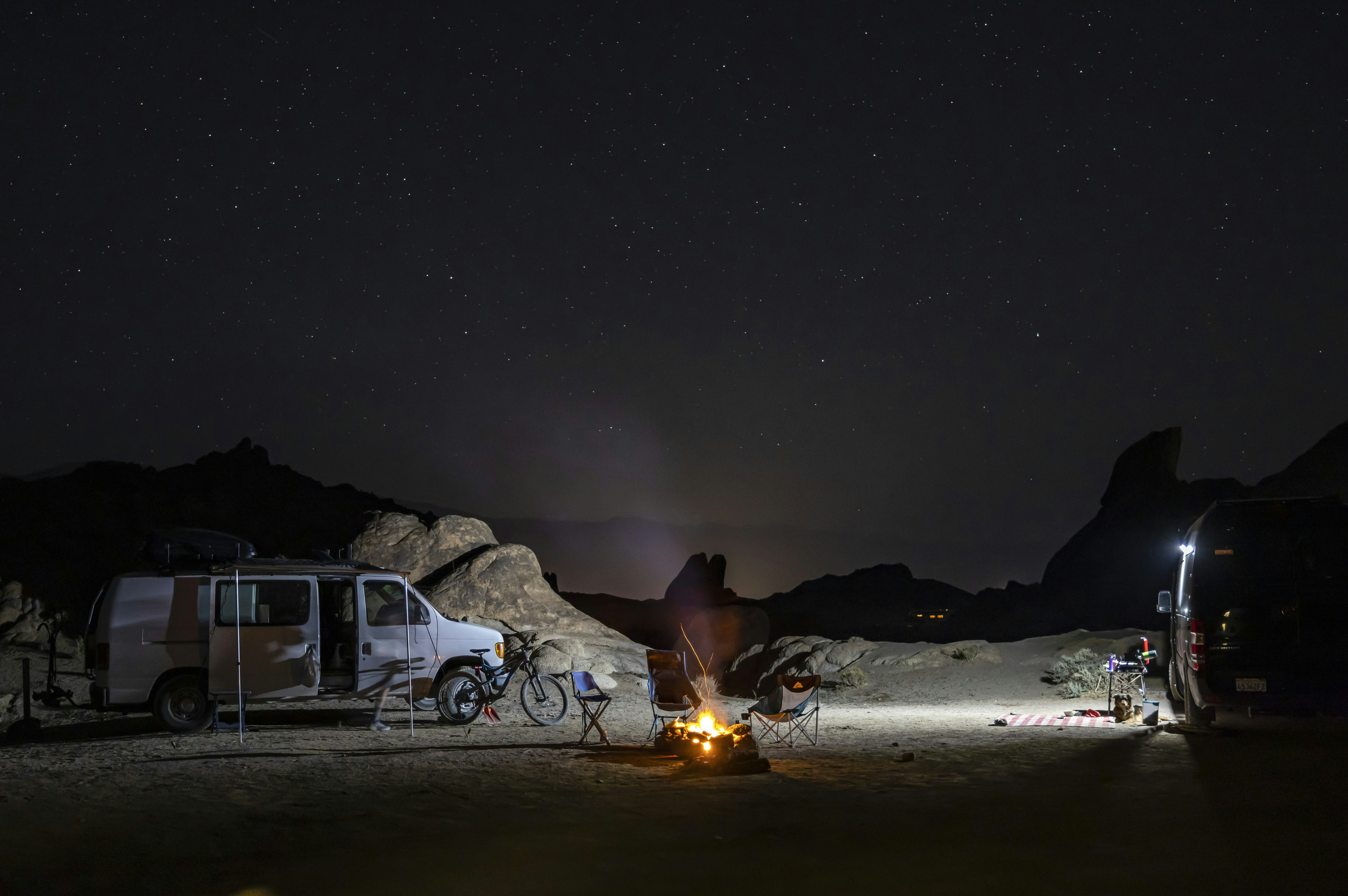 A camp site at night with a campfire and a van photo Free Alabama hills Image on Unsplash