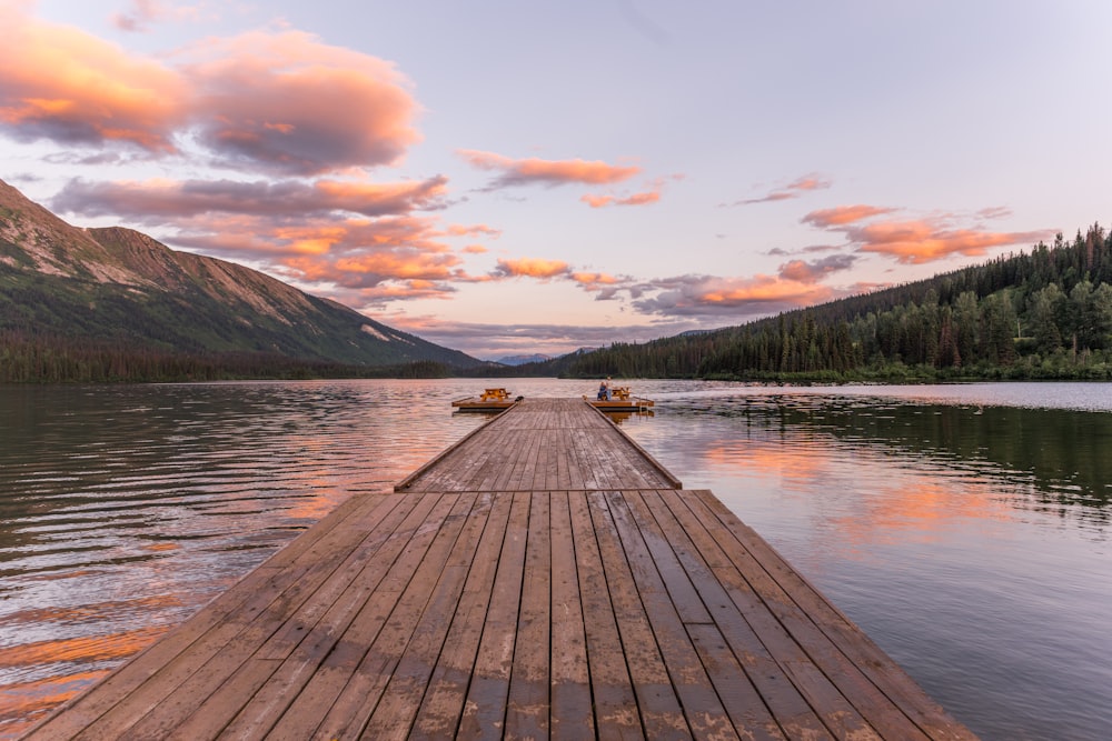 a wooden dock sitting on top of a lake