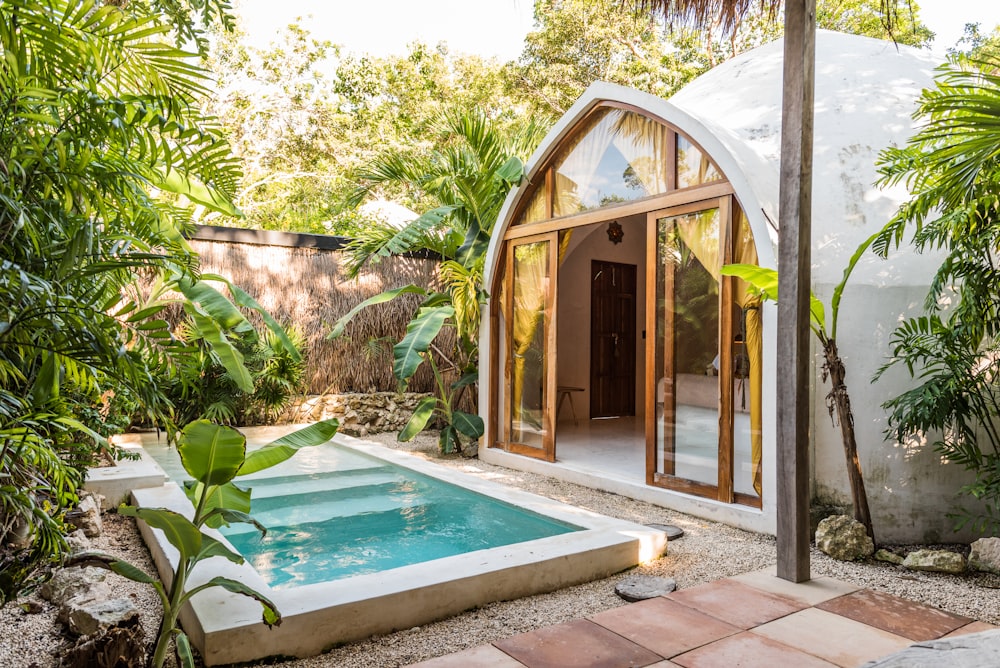 a small pool in the middle of a garden