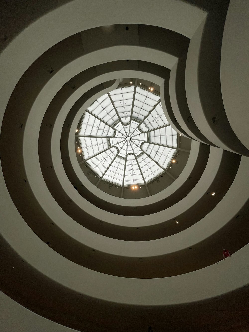 a circular ceiling with a skylight in the center