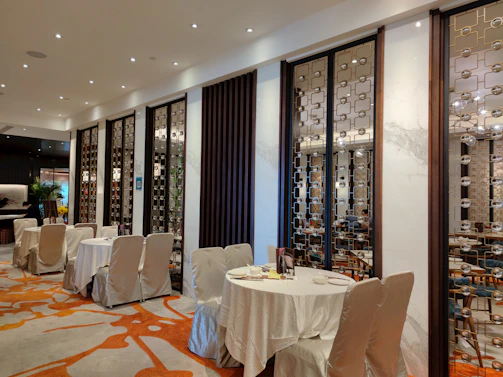 A warm, inviting restaurant interior blending traditional Saudi decor with modern elegance.