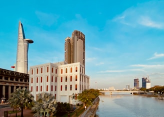a river running through a city next to tall buildings