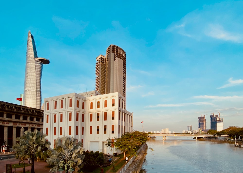 a river running through a city next to tall buildings