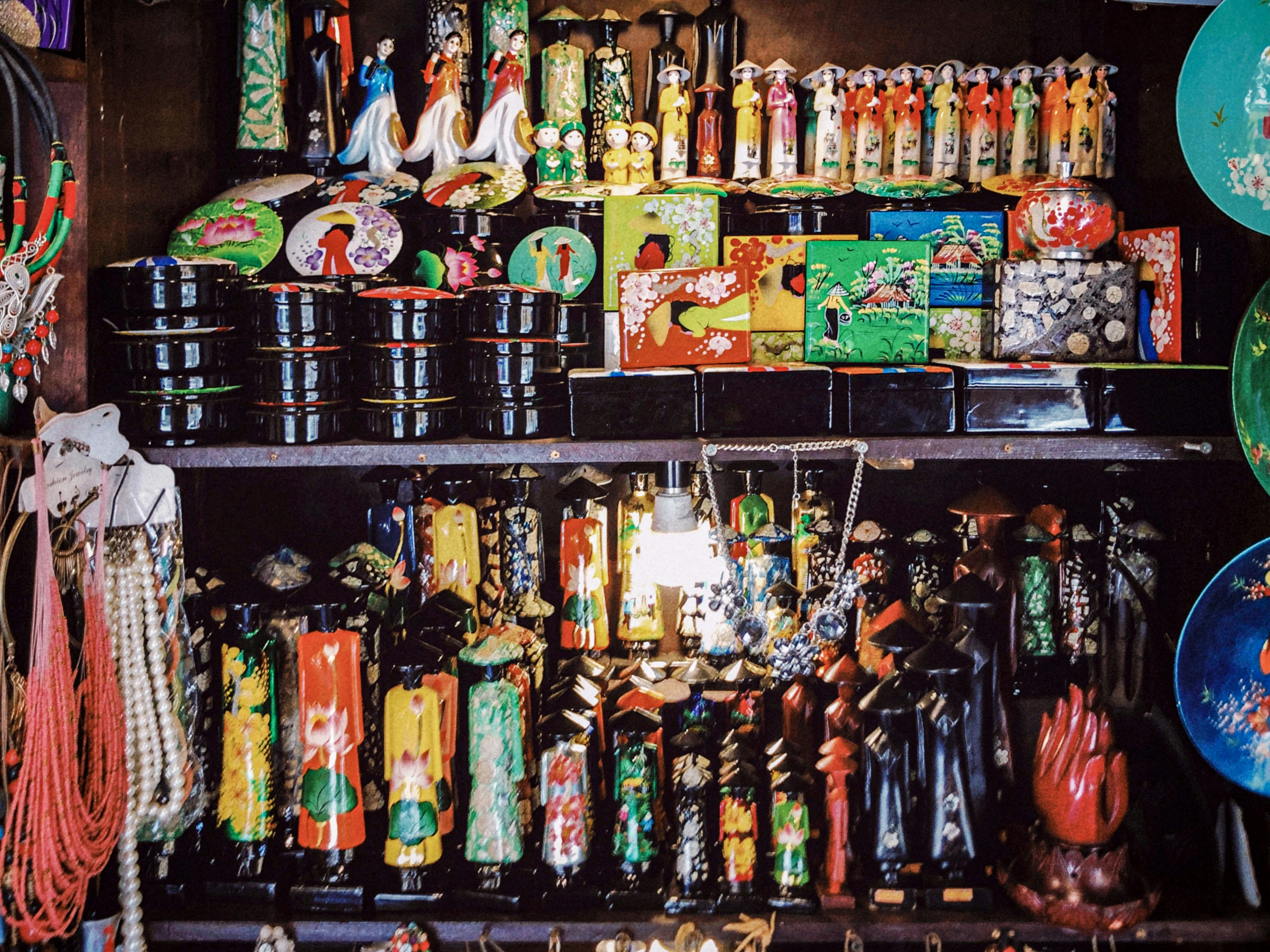 Assorted colorful souvenir items and keepsakes, bright cheerful display, travel mementos