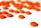 A collection of orange pills scattered on a white surface. Several pills are blurred in the background, while one pill in the foreground is in sharp focus with numbers printed on it.