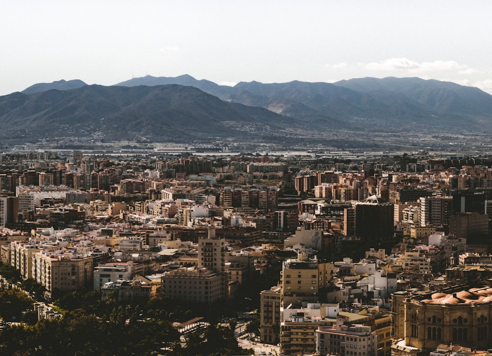 a view of a city with mountains in the background