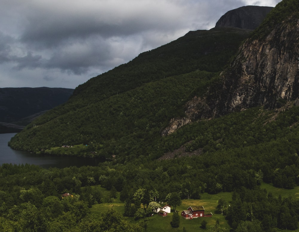 a scenic view of a mountain with a lake in the foreground