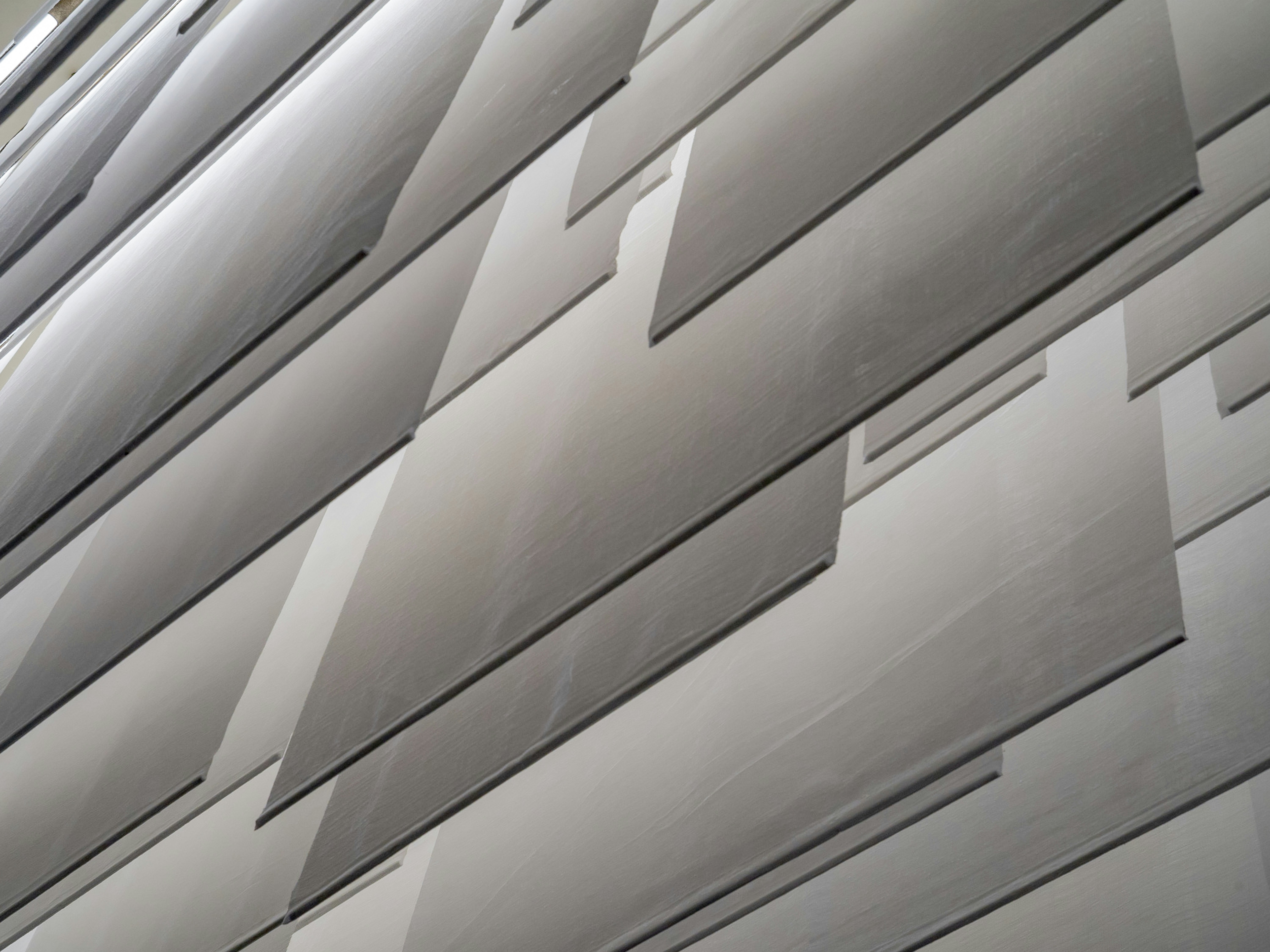 a close up of a building with a lot of papers stuck to it