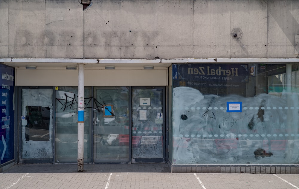 a store front with graffiti on the windows
