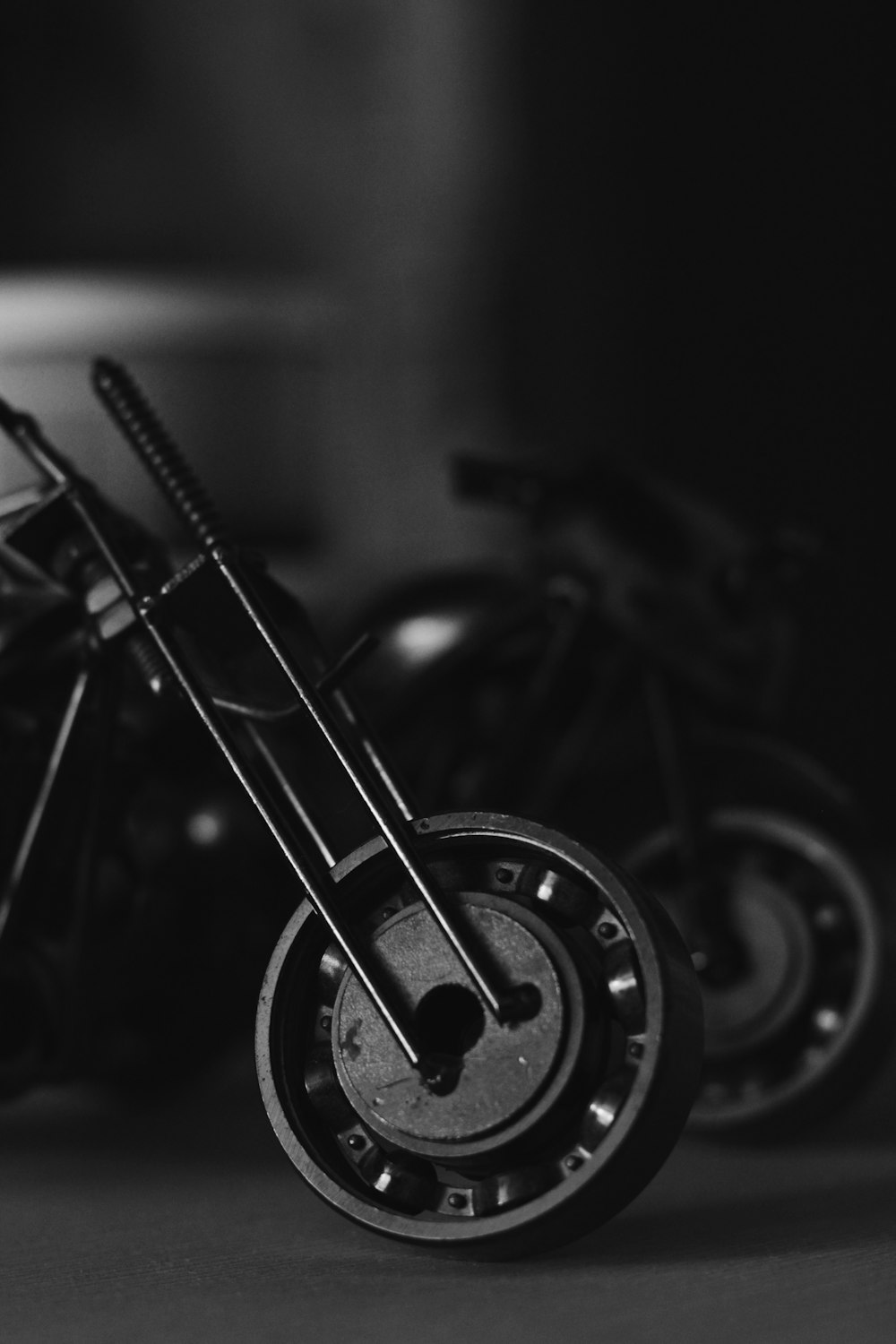 a black and white photo of a toy motorcycle
