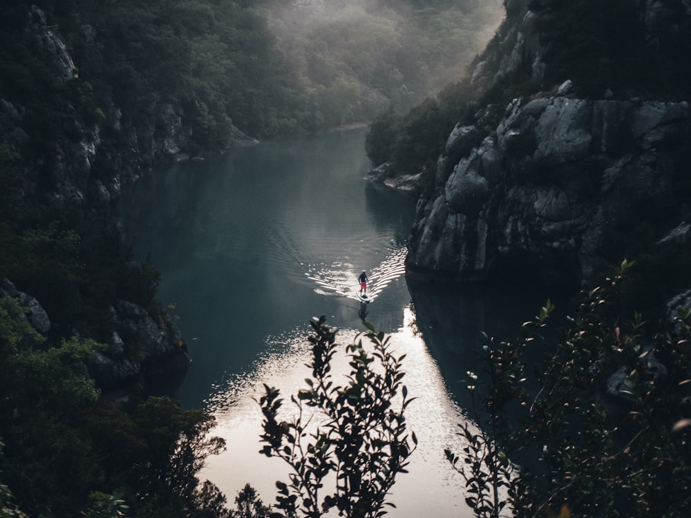 a person on a boat in a body of water