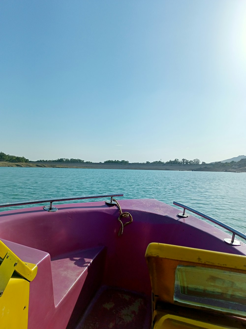 a view of the back of a boat in the water