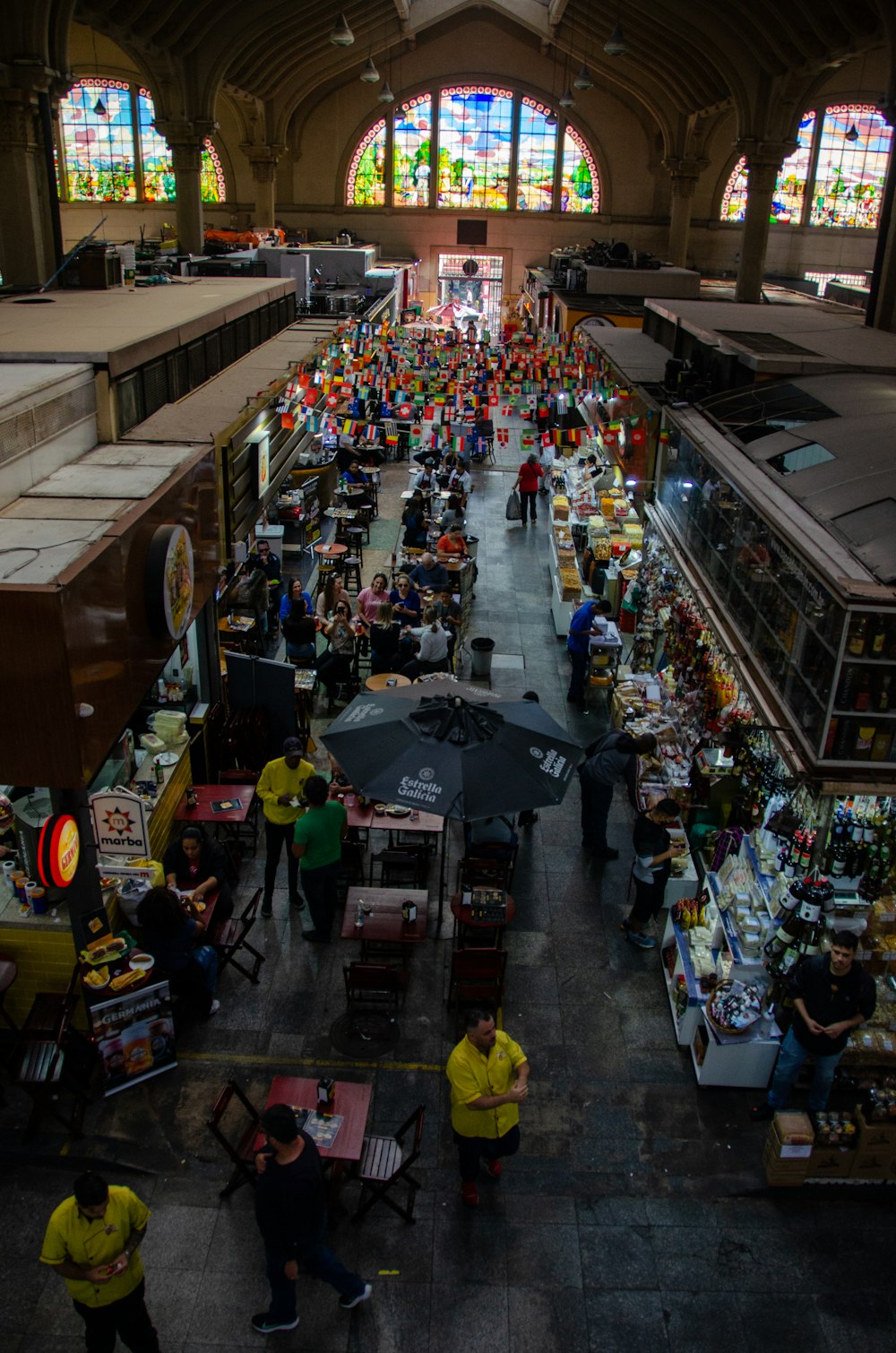 an overhead view of a market with people shopping