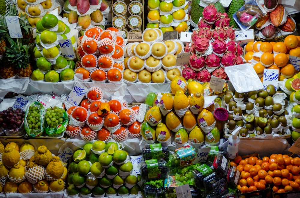 a variety of fruits and vegetables on display at a market