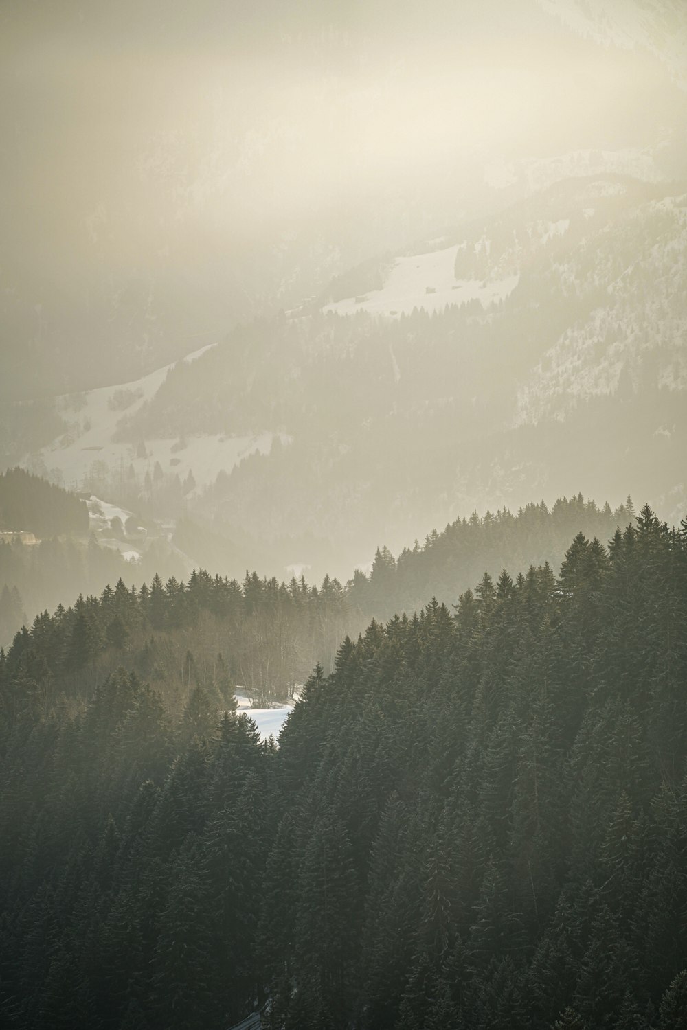 a view of a mountain range with a lake in the foreground