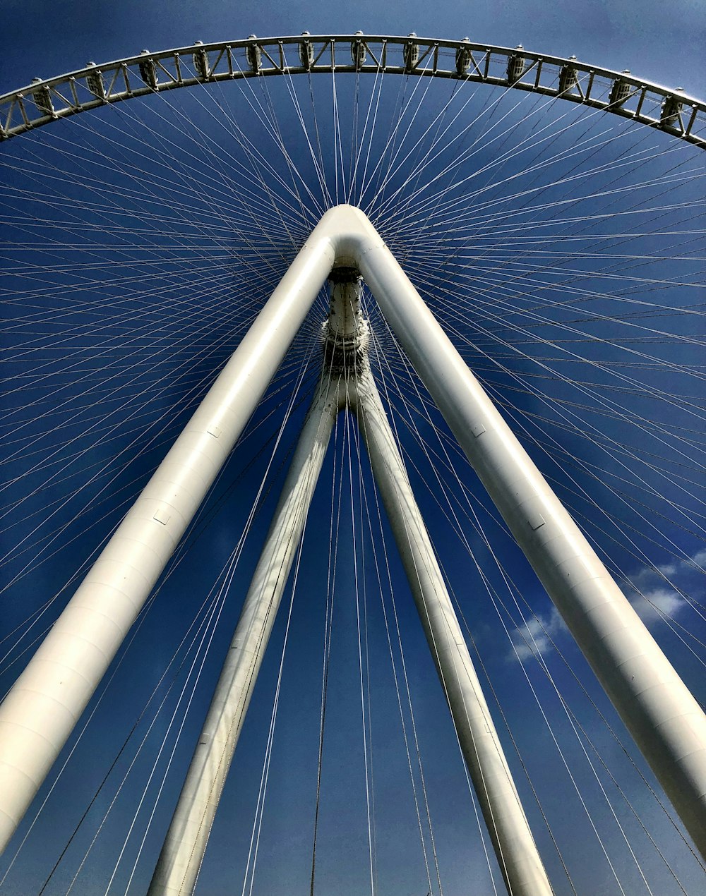 a very tall white structure with a blue sky in the background