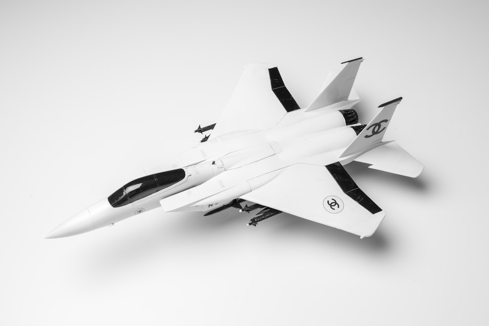 a model of a fighter jet on a white background