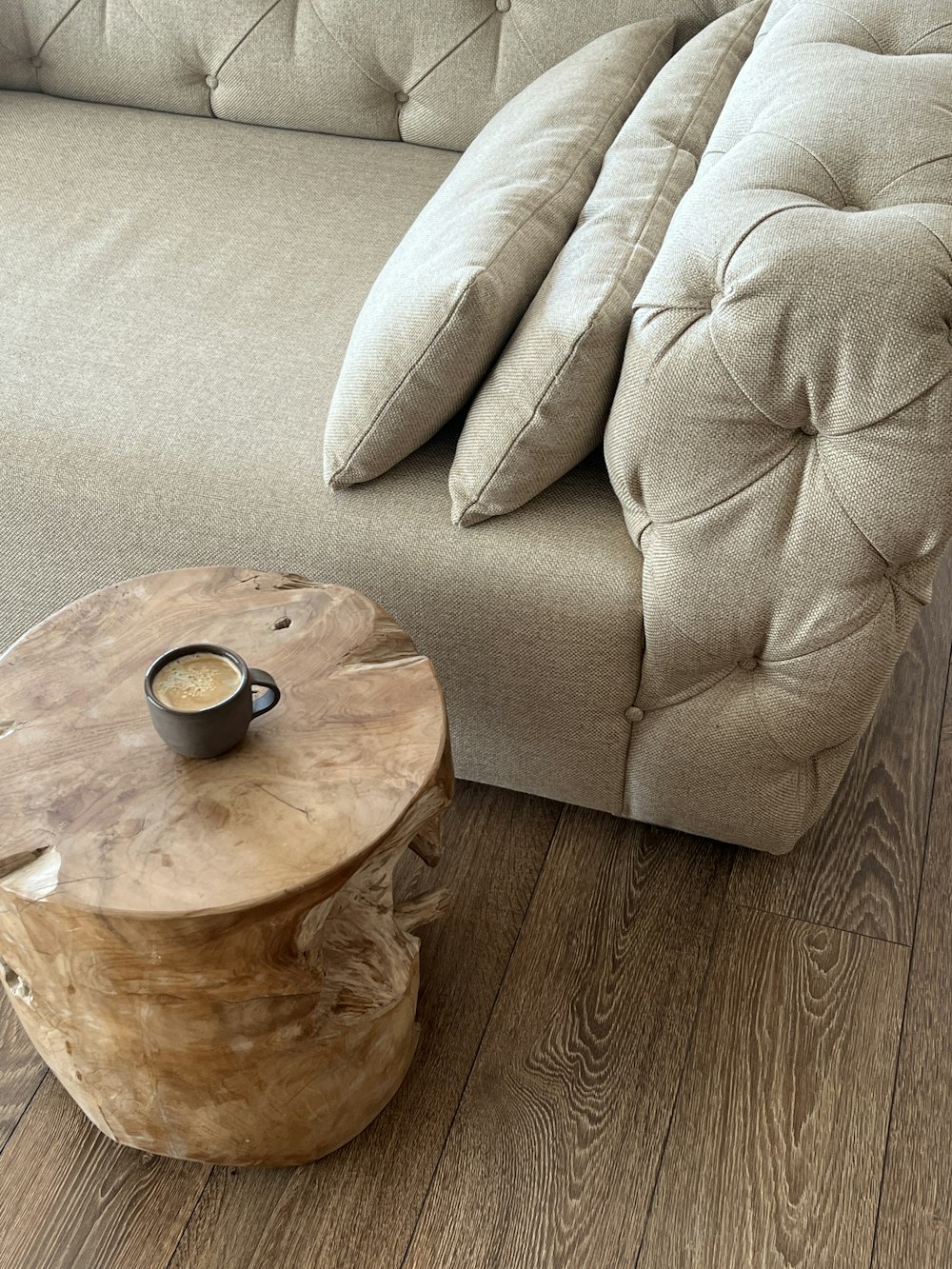 a wooden table sitting next to a couch