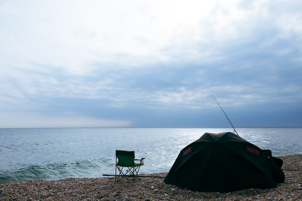 a chair and a fishing rod on a beach