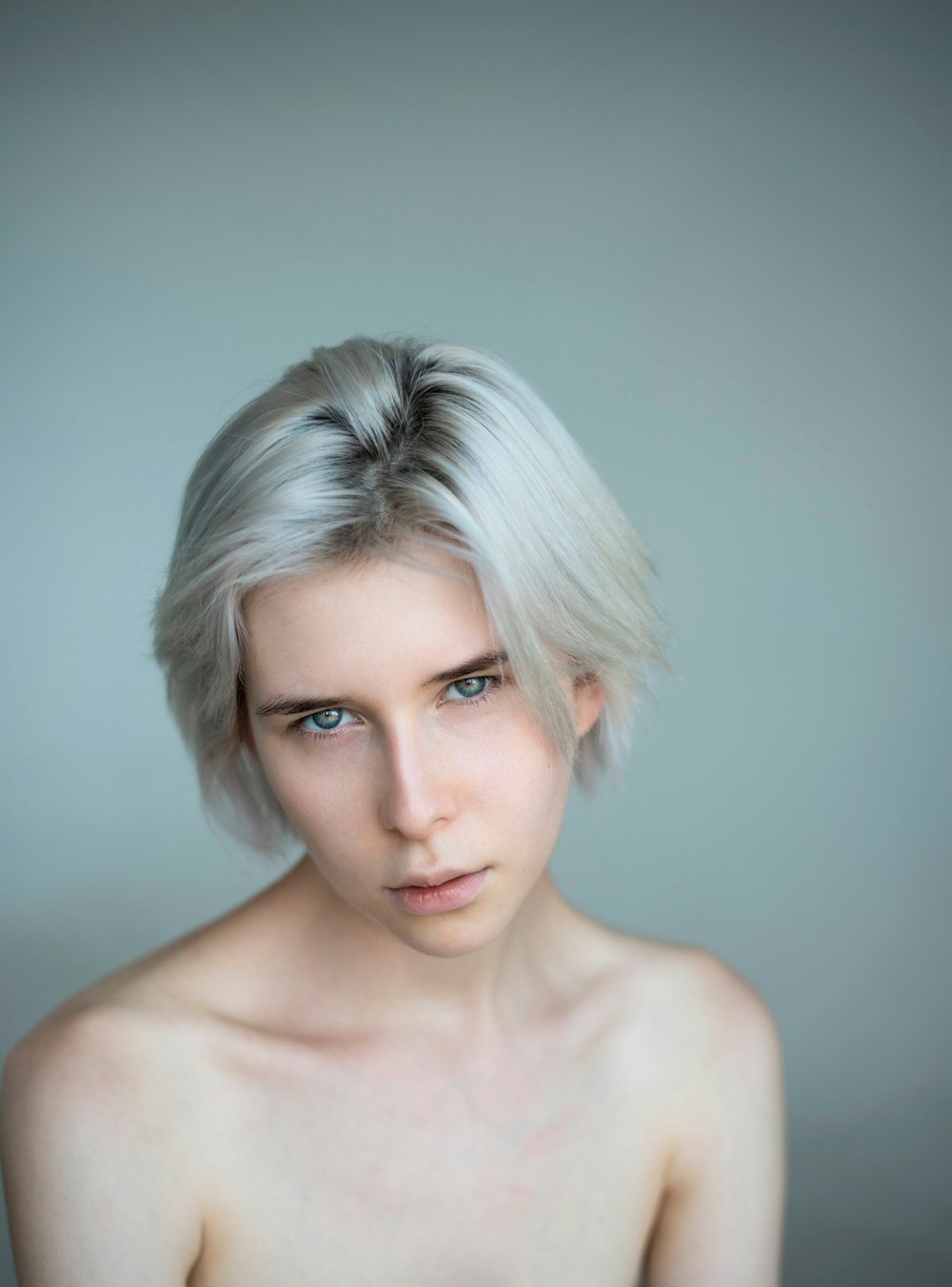 a woman with white hair posing for a picture