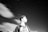 a young man is looking up at the stars in the sky