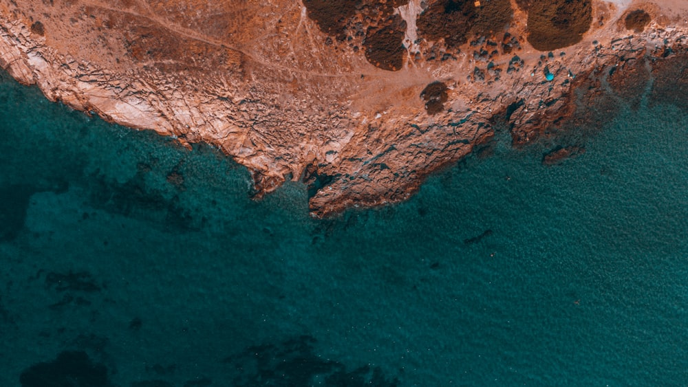 an aerial view of the ocean and land