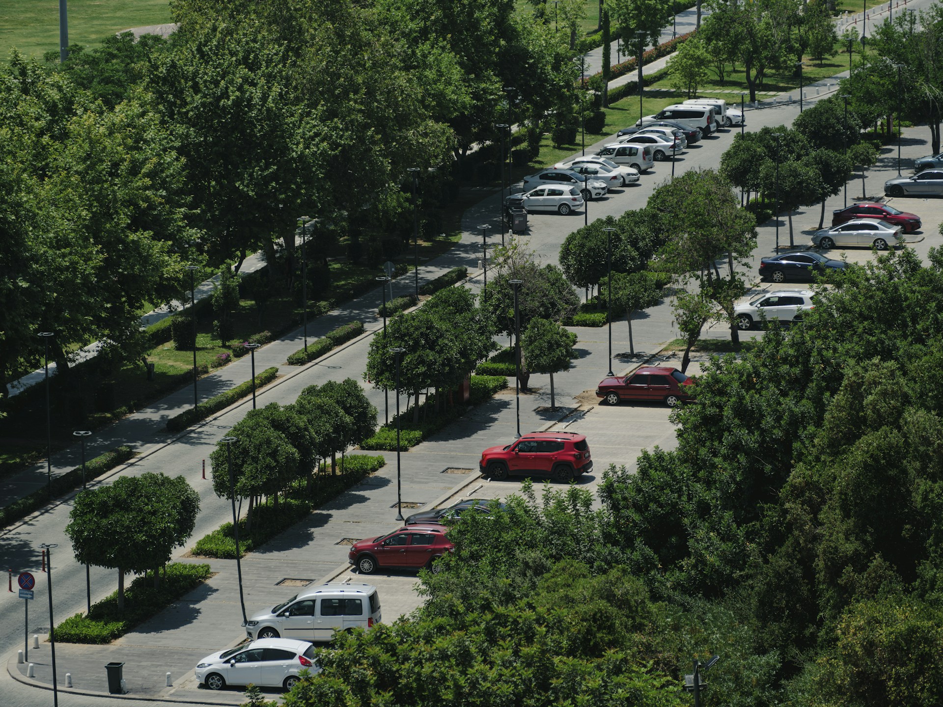 a parking lot filled with lots of parked cars