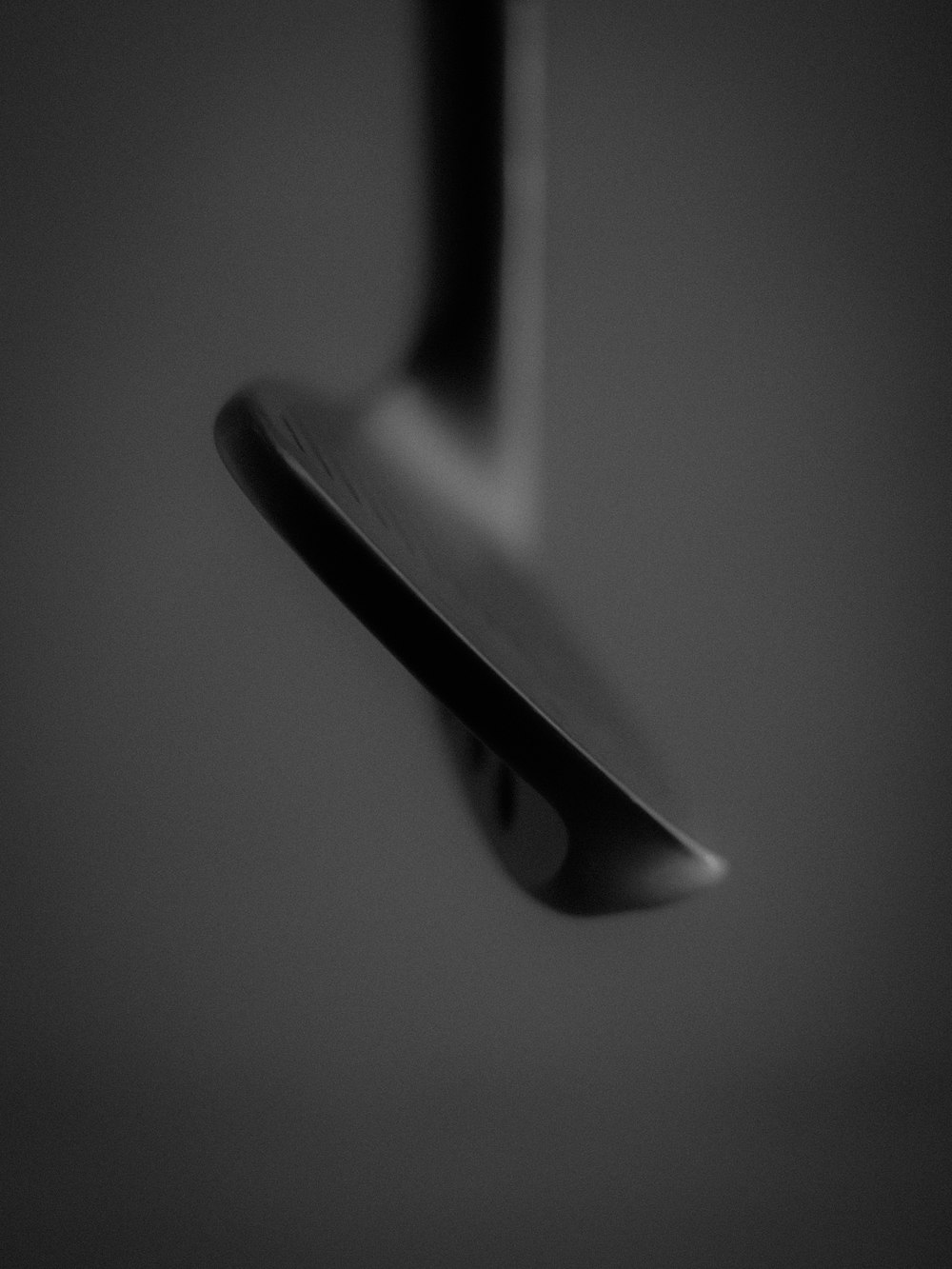 a black and white photo of a spoon