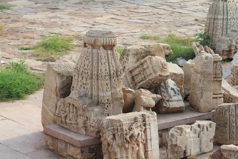 a group of sculptures sitting on top of a sidewalk