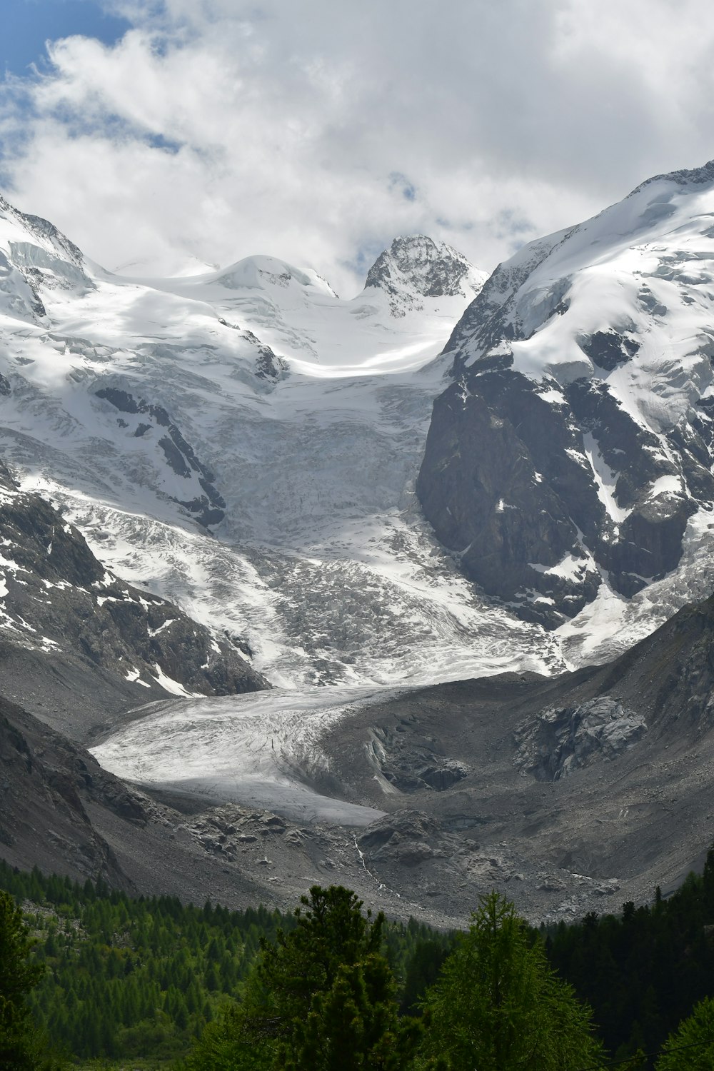 a snow covered mountain with a river running through it