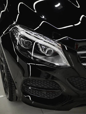 a close up of the front of a black car