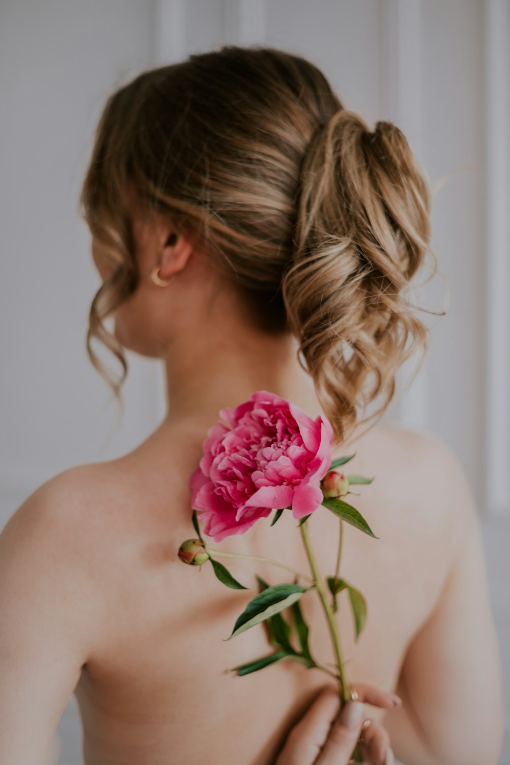 a woman with a flower in her hair